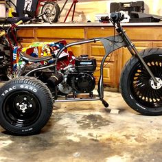 a small motorcycle is parked in a garage