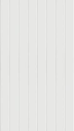 a white wall with vertical lines painted on it and the bottom half is horizontally striped