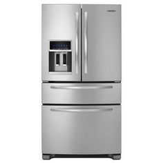 a stainless steel refrigerator freezer with water dispenser and ice maker on the door