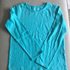 Long Sleeves Aqua Blue Plain Long Sleeves Tee. No Label But Was Never Worn In 100% Cotton. Plain Blue T-shirt For Spring, Basic Plain Blue Tops, Basic Blue Plain Tops, Basic Blue Long Sleeve T-shirt, Blue Long Sleeve Basic T-shirt, Basic Blue Spring Shirt, Casual Plain Blue Tops, Turquoise Long Sleeve Cotton Top, Turquoise Cotton Crew Neck T-shirt