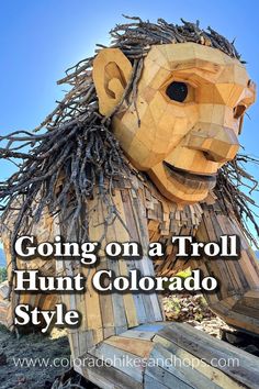 a wooden sculpture with the words going on a troll hunt colorado style written below it