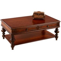 a wooden table topped with a book on top of it's shelf next to a drawer