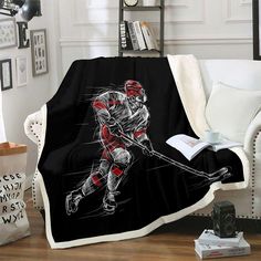 the hockey player is running with his stick in hand and holding a book on the couch