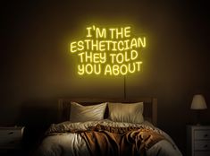 a neon sign that reads i'm the esthetician they told you about