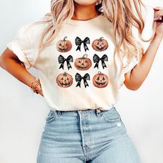 Pumpkin Halloween Tshirt Coquette Halloween Jack o lantern Pink Halloween Spooky season t-Shirt Witchy Halloween Shirt Black Bow Comfort Colors T-shirt Black Coquette and Jack o Lantern pumpkins 𝗢𝗪 𝗧𝗢 𝗢𝗥𝗗𝗘𝗥: 𝟏. Please, check and review listing photos 𝟐. Select Your Shirt size and color from size chart and select from the drop down menus. 3. Choose Your Quantity you want. 𝟒. Click 𝗔𝗗𝗗 𝗧𝗢 𝗖𝗔𝗥𝗧   🫧 C A R E   I N S T R U C T I O N S: - Turn inside out - Wash only with like-colored garments - Wash cold on gentle cycle - Do not bleach -Tumble dry low - Do not iron on printed area P R I N T I N G :  We use an Eco-friendly, Direct-to-Film (DTF) printing is a technique involves printing your design directly onto a film and then transferring it . This creates a very durable pri Cute Halloween T-shirt With Screen Print, Cute Halloween Graphic Print T-shirt, Fall Shirt Ideas, Halloween Shirt Ideas, Retro Coquette, White T-shirt With Custom Halloween Print, Lantern Pumpkins, Cute Halloween Outfits, Black Coquette