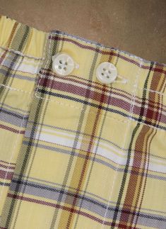 The styling of our woven Perfect Boxer in Yellow and Burgundy Plaid has been meticulously honed to provide the perfect rise and fit. The fit does away with all excess, baggy fabric and is as comfortable when worn under a pair of slim 5-pocket jeans as under dress pants. Our boxer features bespoke details found only in exclusive custom-made boxers. There are two operable buttons at the waist, as well as a functional fly opening. The waistband elastic is fully covered with pleated fabric running t Yellow And Burgundy, Preppy Men, Shirting Fabric, Soft Yellow, Promotional Events, Pleated Fabric, Under Dress, Boxer Shorts, Pocket Jeans