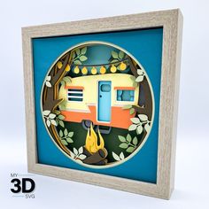 an ornament with a camper on it in a wooden frame