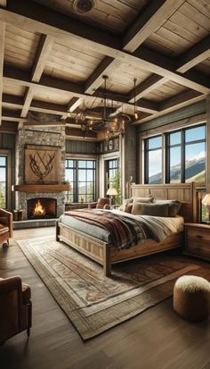 a bedroom with a bed, fireplace and large windows in the room that overlooks mountains