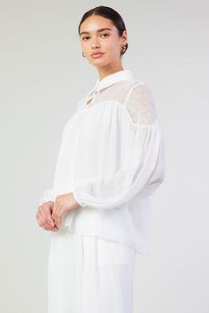 A lace paneled yoke accents this floaty blouse designed with a classic collar at the neck. It's relaxed and airy, enhanced by subtle gathers that create a beautiful drape. •Collared neckline •Button closure •Long sleeves •Elasticized cuffs •Relaxed fit Item number 2430145100% Polyester Elegant Sheer Blouse With Ruffled Collar, Feminine Blouse With Sheer Sleeves For Work, Feminine Lace Top With Sheer Sleeves, Feminine Lace Top Blouse, Elegant Flowy Blouse For Work, Elegant Lace Top With Lace Cuffs For Daywear, Elegant Blouse With Lace Cuffs For Daywear, White Lace Collar Top For Work, Classic Blouse With Lace Sleeves For Daywear