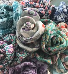 a pile of scarves sitting on top of each other