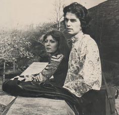 black and white photograph of two people sitting next to each other