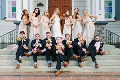 a group of people that are sitting on some steps