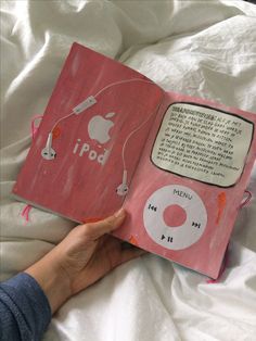 someone is reading an apple book on their bed