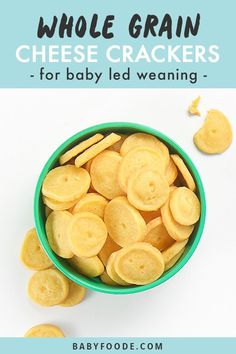 a green bowl filled with cheese crackers for baby and toddlers to make 9 months old