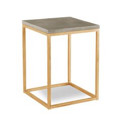 a black and gold side table with a square wooden frame on the top, against a white background