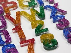 the numbers are made up of different colored glitters