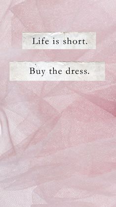 the words life is short, buy the dress on pink and white background with black text