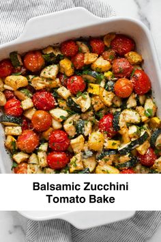 a white casserole dish filled with roasted tomatoes and zucchini tofu