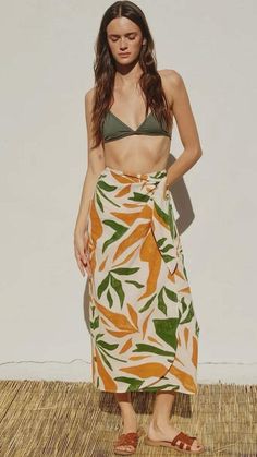 This Malibu Tropical Midi Sarong Wrap Skirt is the perfect summer vacation piece. With its matching crochet halter top, it can be worn on the beach or dressed up for shopping or lunch with friends. The Malibu Tropical Midi Sarong Wrap Skirt is so comfortable yet so chic and its versatility and tropical design make it a must-have for any warm weather getaway! Shop the Malibu Crochet Contrast Halter Top here. Skirt fits true to size. By Dress Forum. Malibu Tropical Midi Sarong Wrap Skirt Details: Knit Sarong, Sarong Wrap Skirt, Pareo Skirt, Matching Crochet, Crochet Halter Top, Skirt Details, Sarong Wrap, Sarong Skirt, Tropical Fashion