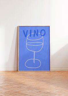 a blue poster with the word vino on it in front of a white wall