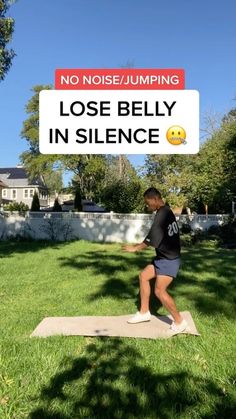 a man standing on a yoga mat in front of a sign that says no noise jumping lose belly in silence