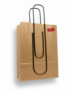 a brown paper bag with a black handle