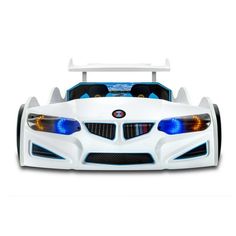 a white toy car with blue lights on it's headlight and front bumper