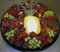 a platter filled with lots of different types of fruit