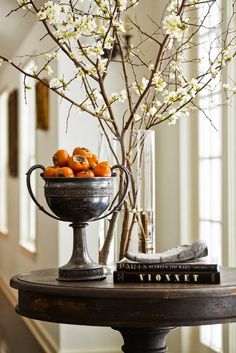 an image of a vase filled with fruit on top of a table