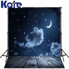 a night scene with the moon and stars in the sky over a wooden floor that is lit up