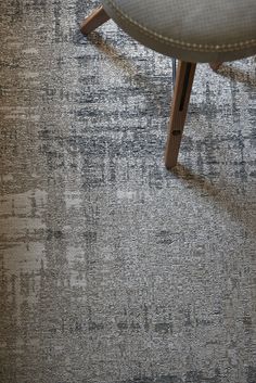 a chair sitting on top of a carpet covered floor