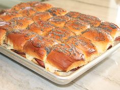 a tray with hot dogs on it sitting on a counter