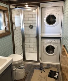 a washer and dryer in a small bathroom