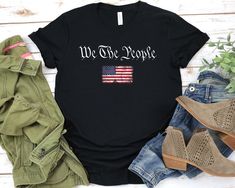 We The People Shirt, Patriotic T-shirts, American Flag Shirt, Vintage USA Flag 1776, US Flag T-shirts, Patriotic Shirts For Men We The People Shirt - Unisex T Shirt, Women Racerback Tank, Long Sleeve T-Shirt Tees Tshirt Sweatshirt Sweater Hoodie Gift For Men Women Boys Girls Well, let's say goodbye to all this boring apparel... The GodBlessThisDesign team creates custom clothes with great designs to suit all tastes. Our unique and blessed designs are a blast fit for every occasion and always a p Patriotic Clothing For Women, America Shirts, Patriotic Designs, Dc Trip, Modern Shelf, Army Women, We The People, American Flag Shirt, Vintage Usa