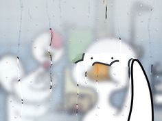 a window with rain drops falling on it and a white bird sitting in the background