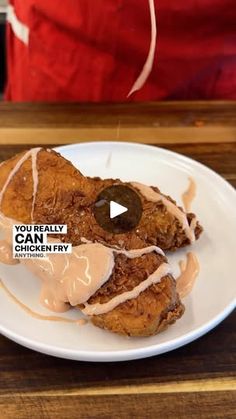 the fried chicken is covered with icing and drizzled