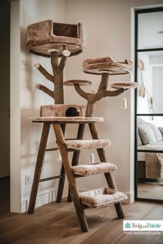 a cat tree that is in the middle of a room with a ladder on it