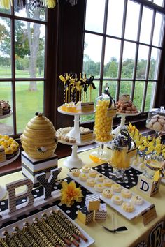 a table filled with lots of food and desserts