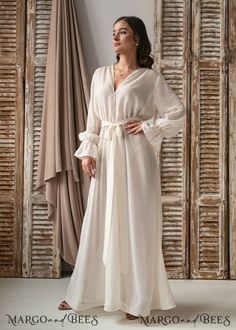 Elegant V-neck Robe For Evening, Elegant V-neck Bridal Dress, Wedding Maxi Dress With Satin Finish, Elegant Cream Wedding Gown, Feminine Wedding Dress With Satin Finish, Floor-length Satin Finish Gown For Wedding, Chic Satin Finish Wedding Maxi Dress, Elegant Flowy Gown For Bridesmaid, Silk Fitted Robe For Wedding Night