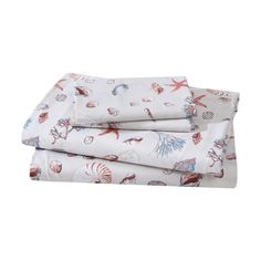 three sheets with sea animals on them, one in white and the other in red