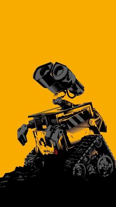 a black and yellow photo of a remote control vehicle on top of a hill in the sun