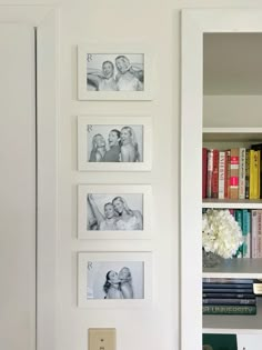 a white book shelf with pictures on it