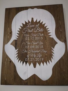 a wooden sign with the date and wedding date on it is mounted to a wall