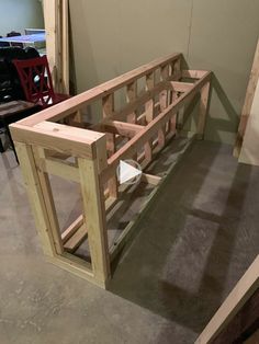 a wooden bench sitting on top of a hard wood floor