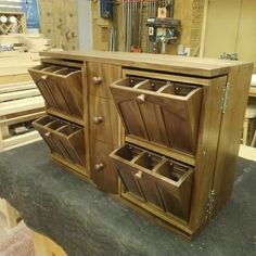 a wooden cabinet with several drawers on it