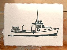 a black and white drawing of a boat on top of a piece of paper next to a wooden table