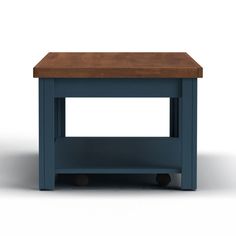 a small blue table with wheels on the bottom and a wooden top, sitting against a white background