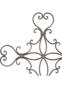 an iron wall hanging decoration with hearts on the top and bottom, set against a white background