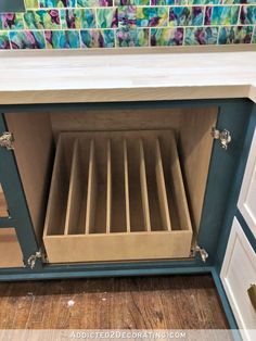 an empty drawer in the middle of a cabinet