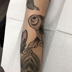 a person with a bird tattoo on their arm